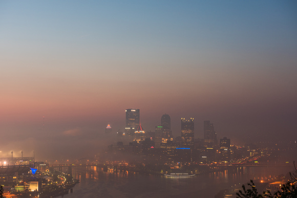 Pittsburgh sits int he fog just before sunrise