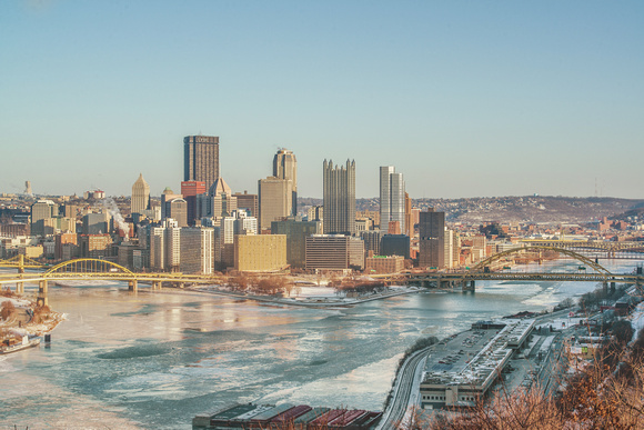 Pittsburgh skyline and the ice at the Point from the West End Overlook in winter