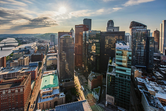 The sun shines over downtown Pittsburgh from above