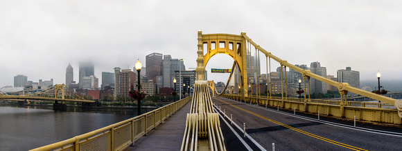 A foggy panorama of the Roberto Clemente Bridge in Pittsburgh