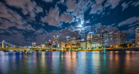 Full moon behind the clouds over Pittsburgh
