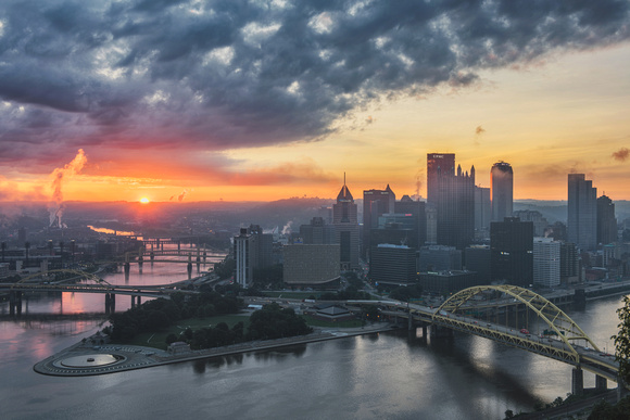 The sun crests the horizon in Pittsburgh at dawn