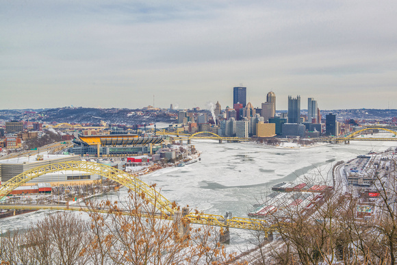 The ice covered Point and Ohio River in Pittsburgh from the West End Overlook in winter