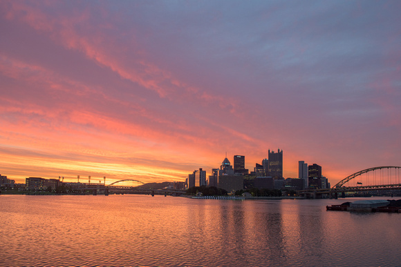 Colorful skies brighten the Pittsburgh sunrise on a summer morning