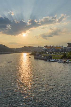 Sunlight on the Allegheny in Pittsburgh and the LST 323 World War II Transport Ship