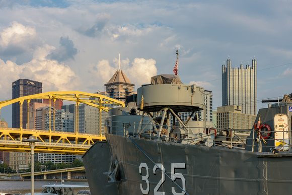 Gun turret on the LST 323 World War II Transport Ship and Pittsburgh skyline