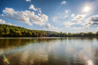 A sun flare over the lake at Keystone State Park HDR