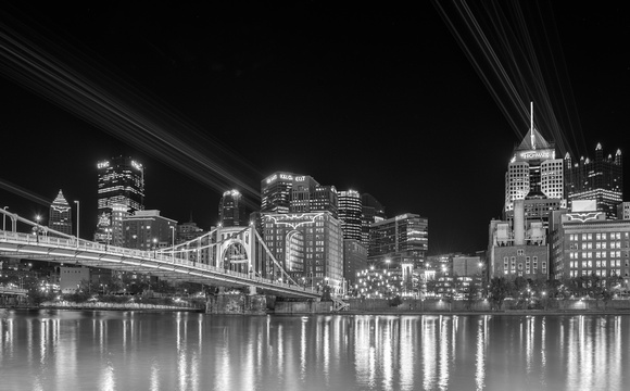 Lasers illuminate Bat Signals on downtown Pittsburgh in B&W
