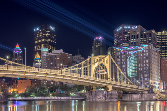 Lasers illuminate Bat Signals on downtown Pittsburgh