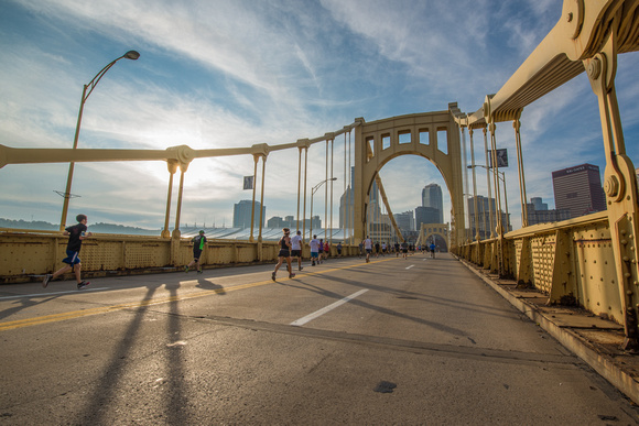 Runners race across the Roberto Clemente Bridge in Pittsburgh