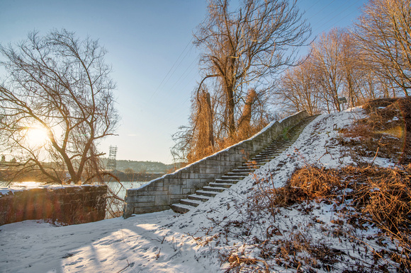 Steps leading up a snow covered Herr's Island in Pittsburgh