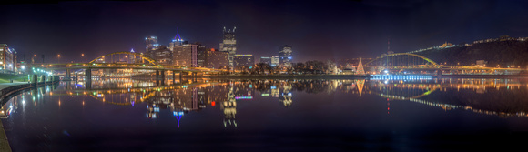 Panorama of Pittsburgh and the Christmas tree reflecting in the river
