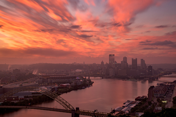 A red sky over Pittsburgh at dawn from the West End Overlook