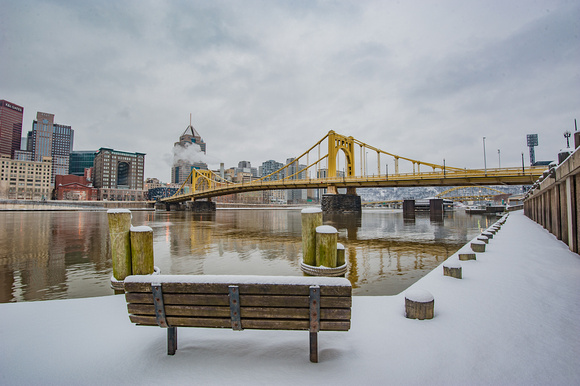 A snowy bench on the North Side of Pittsburgh