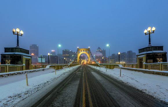 Snowy tracks on the Clemente Bridge in Pittsburgh
