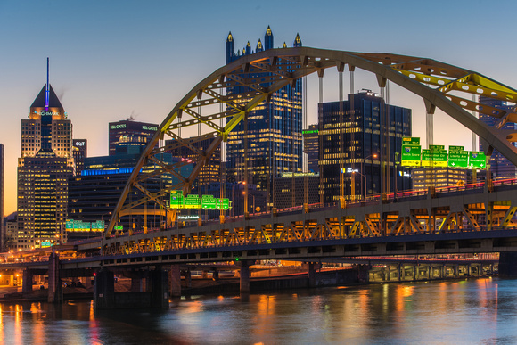 Pittsburgh glows behind the Ft. Pitt Bridge at dawn