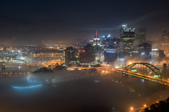 Pittsburgh is blanketed in fog in the night