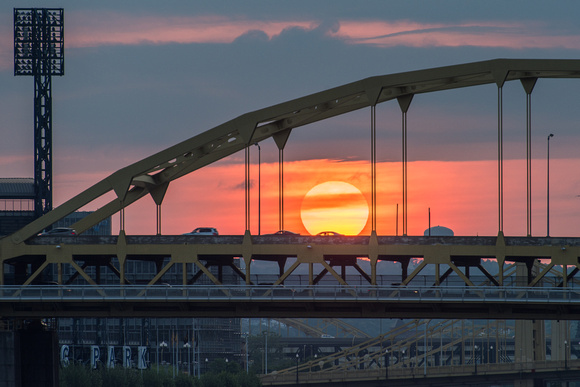 The rising sun framed by the Ft. Duquesne Bridge in Pittsburgh