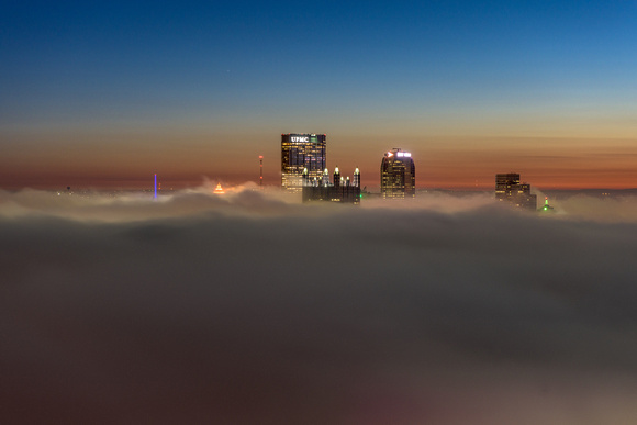 Pittsburgh rises above the fog just before dawn