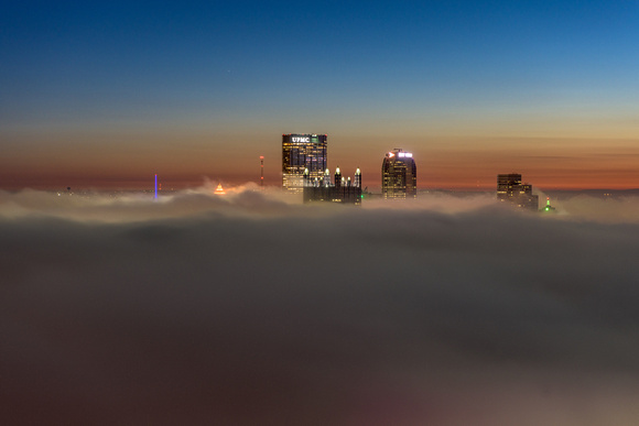 Pittsburgh can be seen above the fog