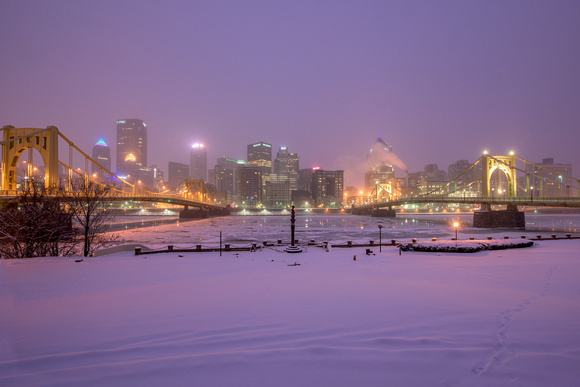Purple skies over a snow Pittsburgh from the North Shore