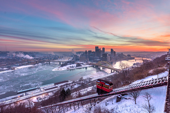 The Duquesne Incline climbs Mt. Washington in Pittsburgh during a vibrant winter sunrise