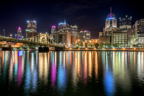 A rainbow of colors in the river at Pittsburgh