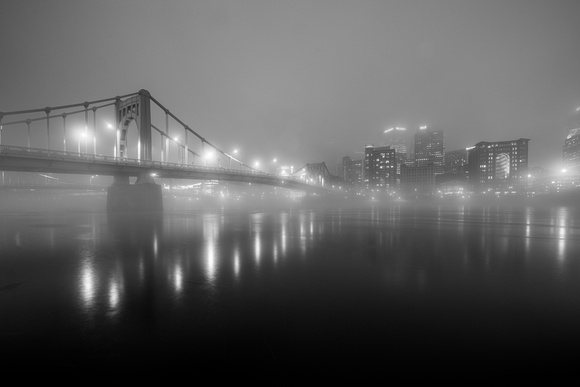 The Andy Warhol Bridge glows in the fog in Pittsburgh
