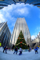 Skaters circle the tree at PPG Place