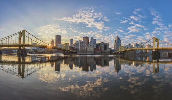 Panorama of Pittsburgh reflecting in the Allegheny River at dawn