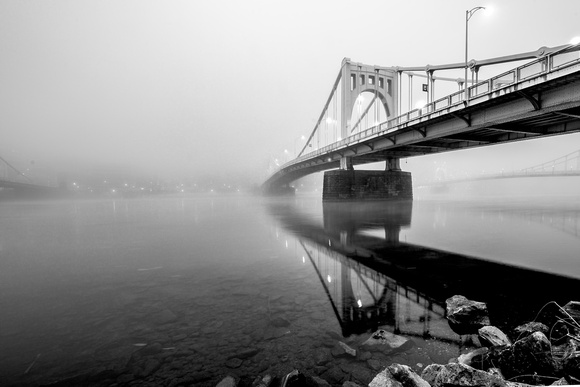 The Clemente Bridge disappears into the fog in Pittsburgh