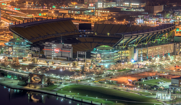 Heinz Field lit up at night from the roof of PPG Place