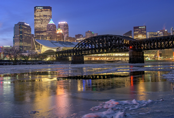 Pittsburgh reflects in the icy Allegheny at dawn