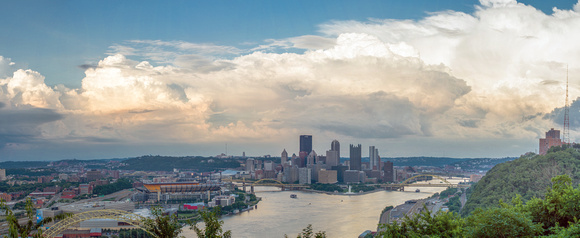 A panorama of huge clouds over the Pittsburgh skyline from the West End Overlook