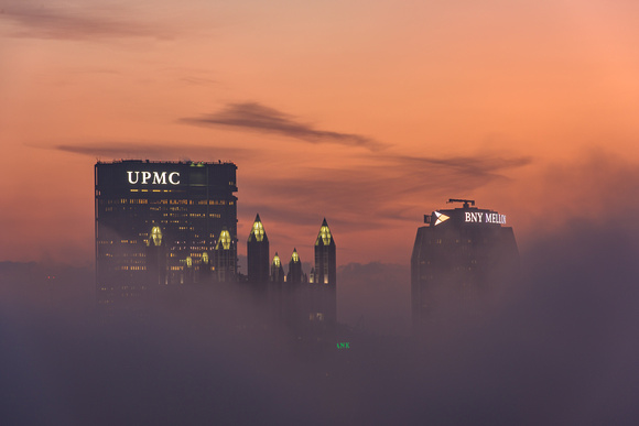 The rooftops of Pittsburgh above the fog