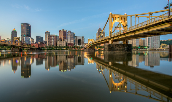 Near pristine reflections of the Roberto Clemente Bridge in Pittsburgh