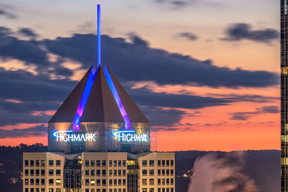 Fifth Avenue Place glows against a beautiful sky