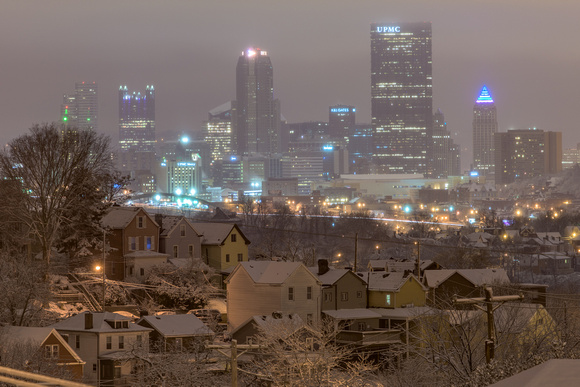 Snow falls on the Pittsburgh skyline from Greenfield
