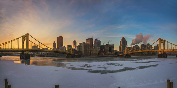 Panorama of sunrise rom the North Shore of an icy Pittsburgh