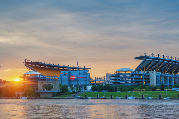 The sun sets behind Heinz Field in Pittsburgh