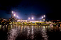PNC Park lit up at night from the Allegheny River
