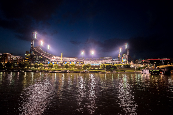 PNC Park lit up at night from the Allegheny River
