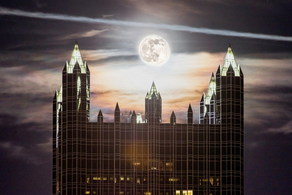 The moon hangs over PPG Place in Pittsburgh