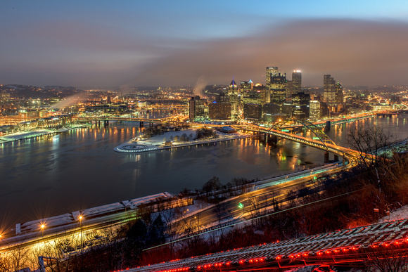 The Duquesne Incline streaks down Mt. Washington on a snowy evening in Pittsburgh