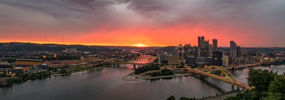 The sky glows as the sun is about the cross the horizon in Pittsburgh