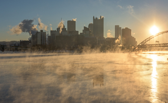 Steam rises from the ice on a cold Pittsburgh morning