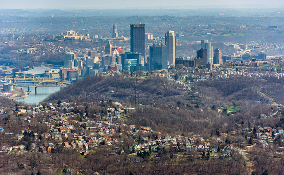 Aerial of Pittsburgh as it rises over the hills