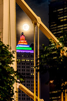 The Andy Warhol Bridge frames the moon and the Gulf Tower