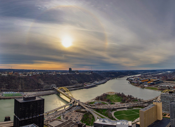 Panorama of rainbow halo around the sun at dusk in Pittsburgh