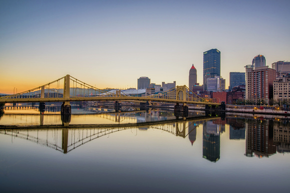The Pittsburgh skyline and Andy Warhol Bridge reflects in the Allegheny River HDR